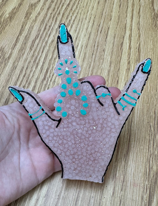 Hand with turquoise Freshie-Mama Tried
